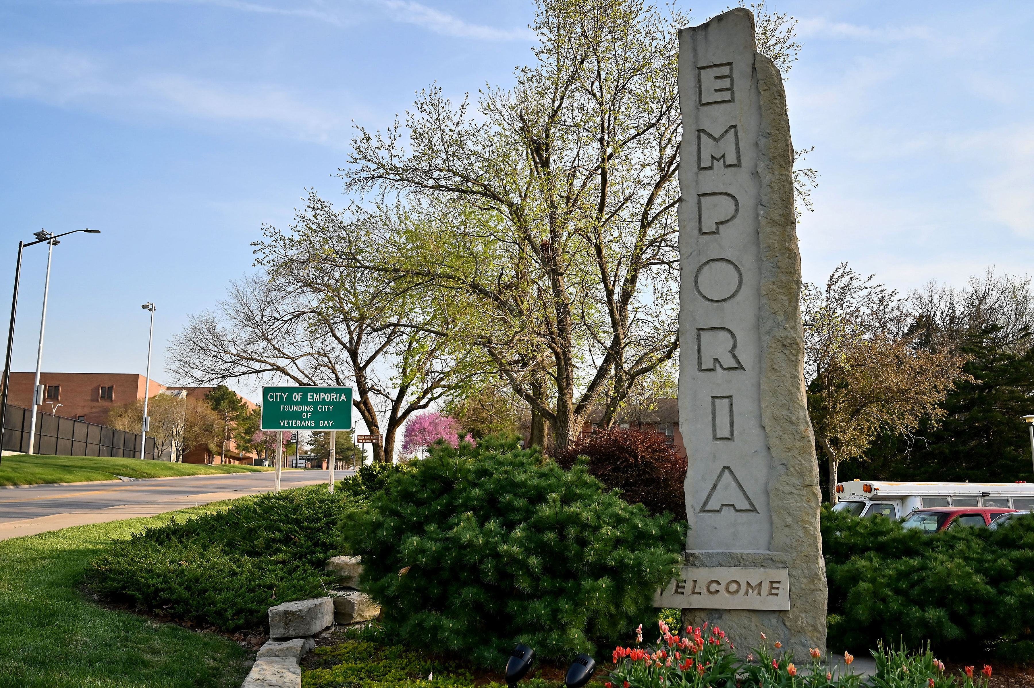 Emporia welcome monument beside a road, with the city name carved into stone